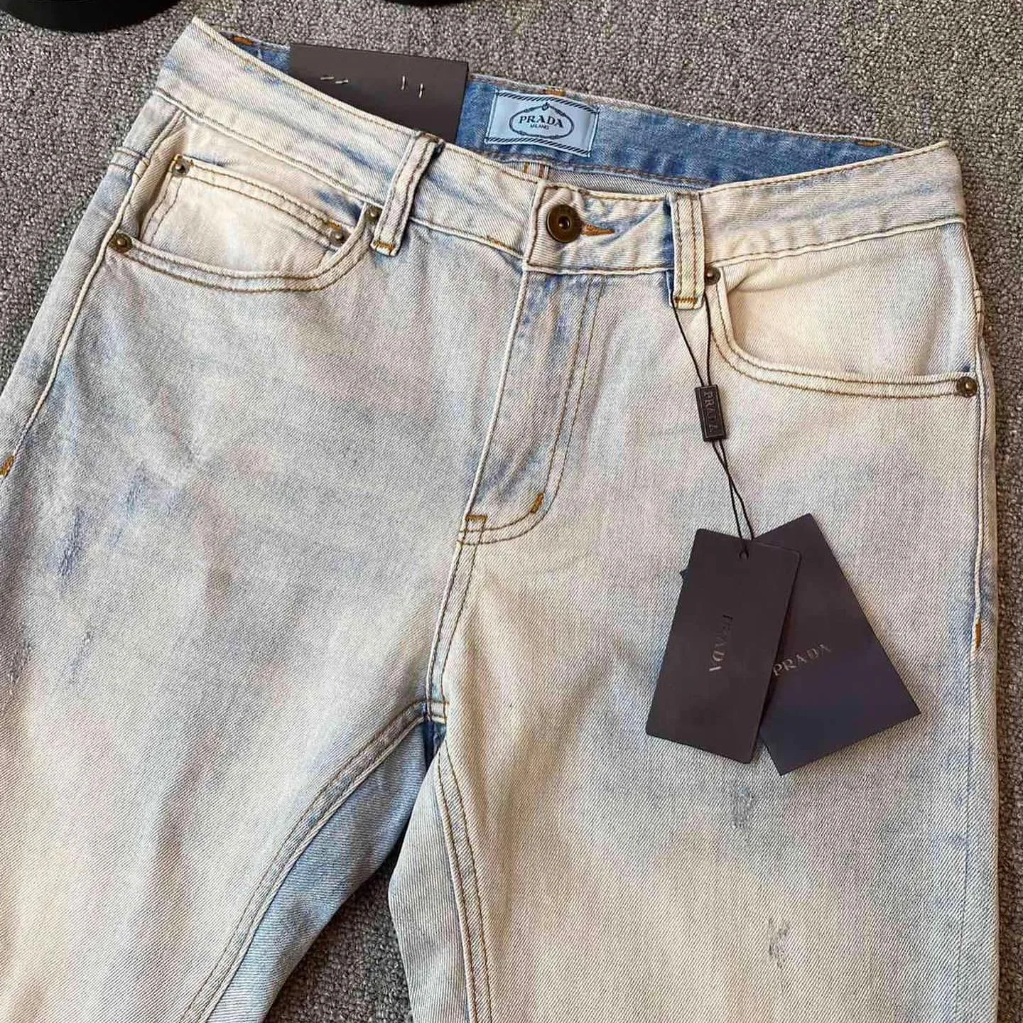 Prada triangle-logo denim jeans photo 1